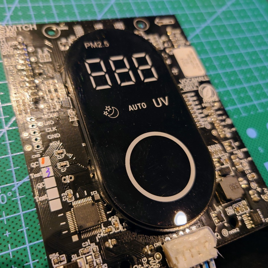 A picture of the Display Panel of the device.

It predominantly shows a stenciled LED panel with a large circle and various mode icons, as well as three seven segment displays.